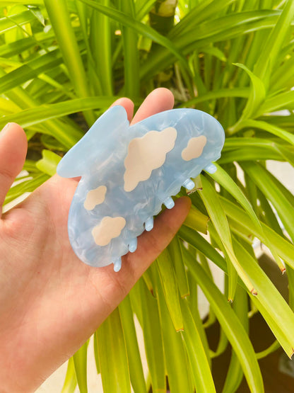white clouds in the blue sky claw