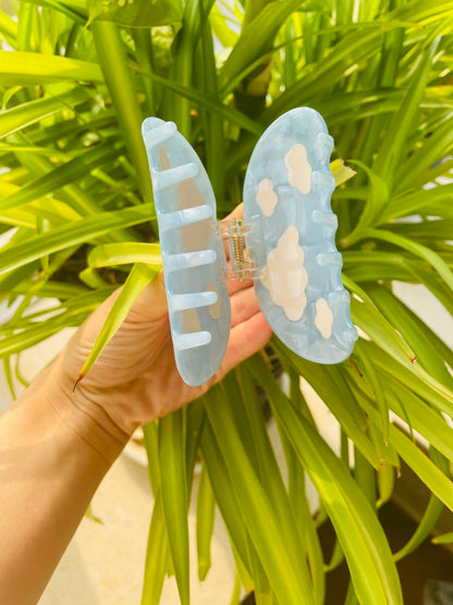 white clouds in the blue sky claw
